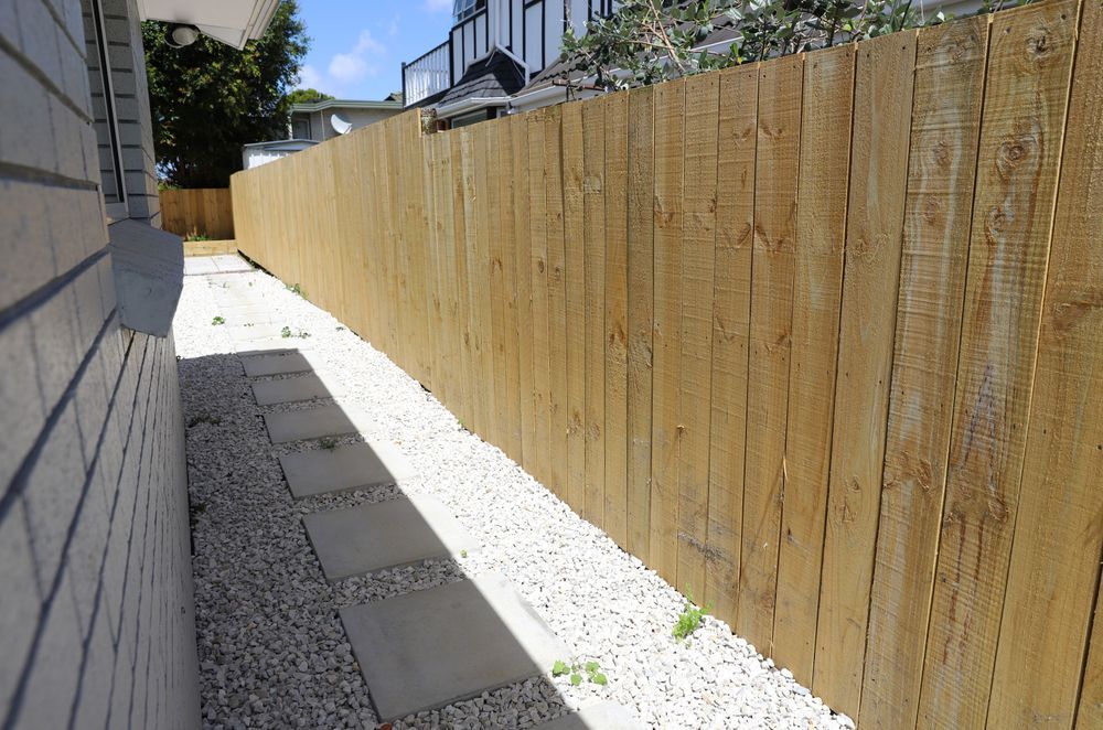 We created pathways around the house to get from one section of the exterior to another. This pathway leads from the front garden to the back of the house where we created a vegetable garden and patio