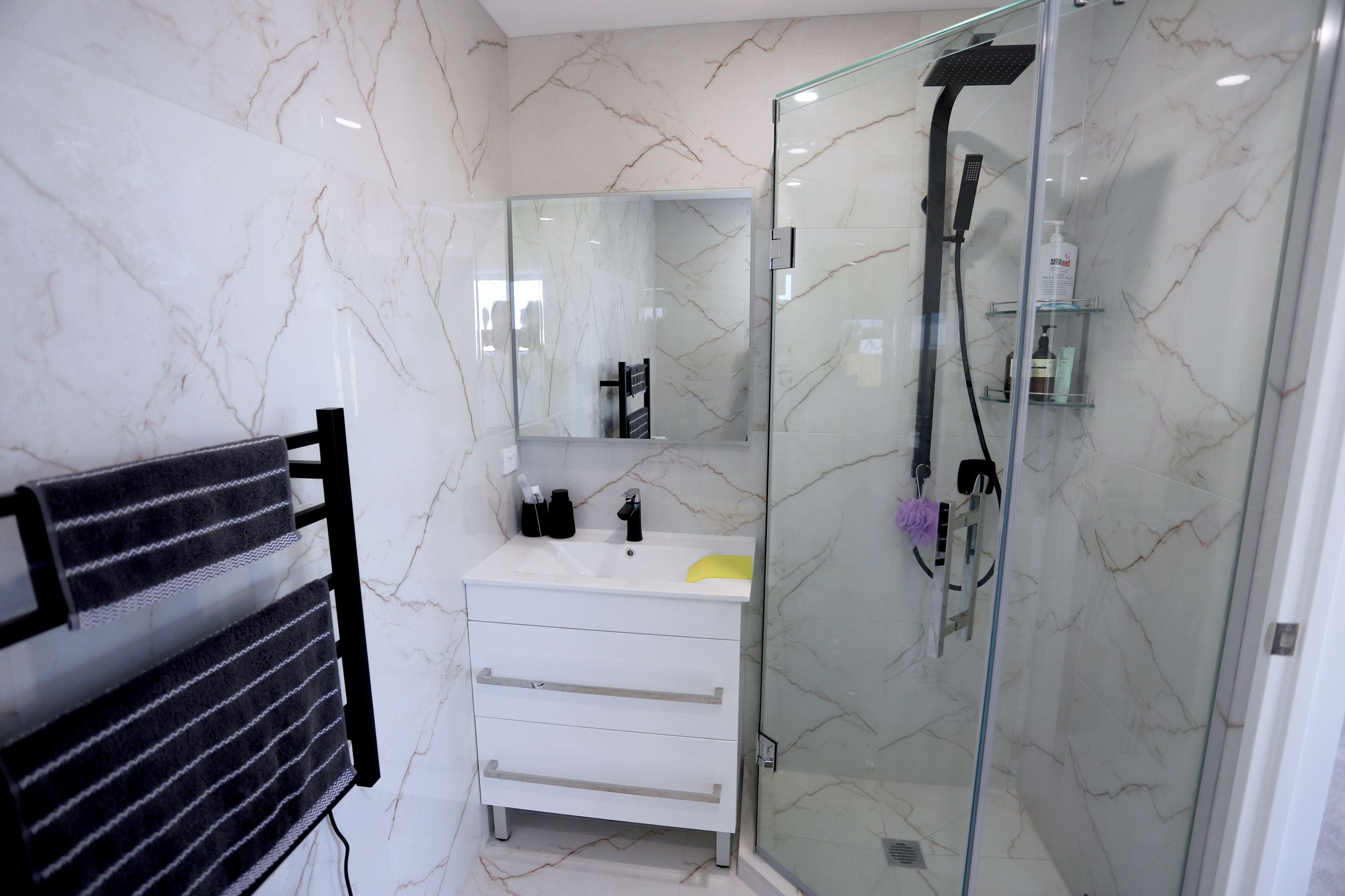 A corner L shaped shower installed to maximise space
