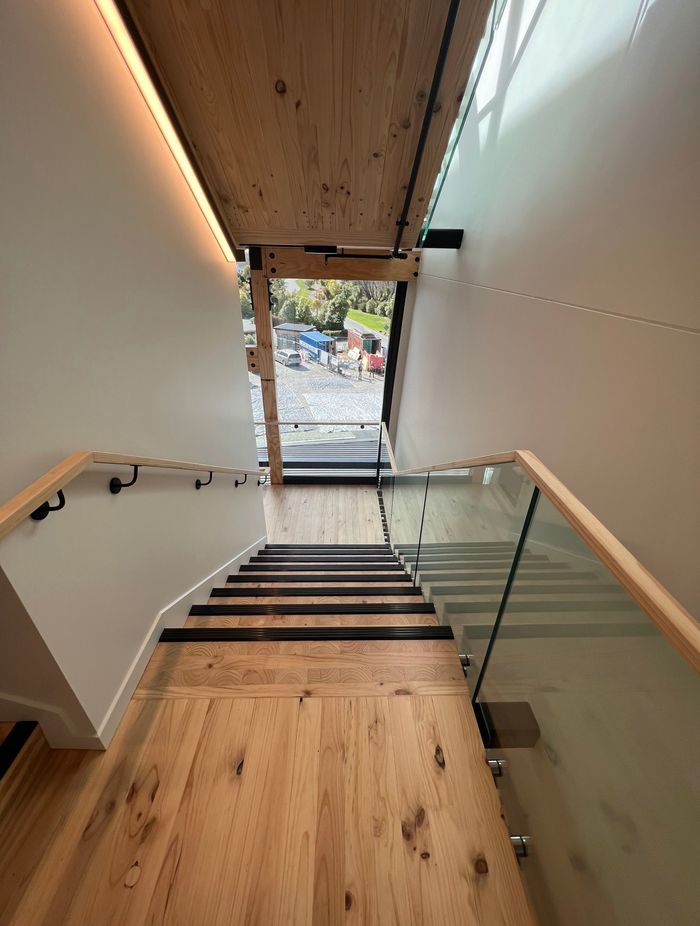 The stairwell also features beautiful timber floors and exposed LVL beams.