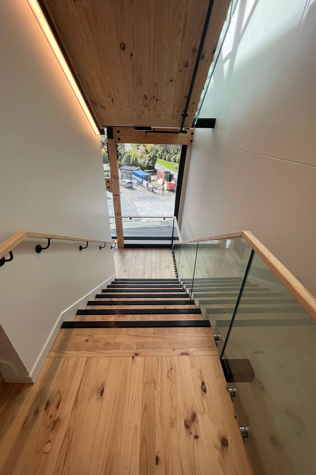The stairwell also features beautiful timber floors and exposed LVL beams.