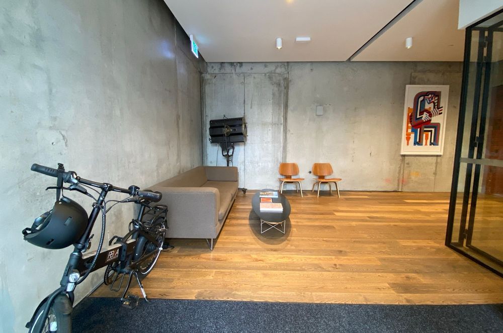 The new offices of Paul Brown &amp; Associates features an industrial aesthetic that the company didn't want to compromise with a traditional HVAC system. The Active Ceiling system's concealed nature was the ideal solution.