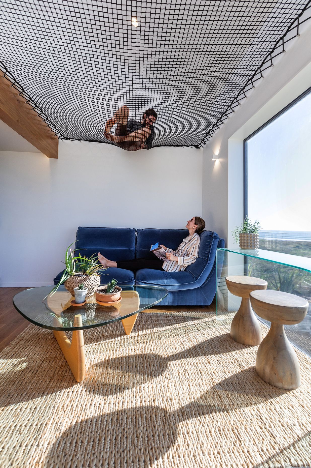 Homeowners Matthieu and Maria, lounging in the smaller pod. | Photographer: Sandra Henderson