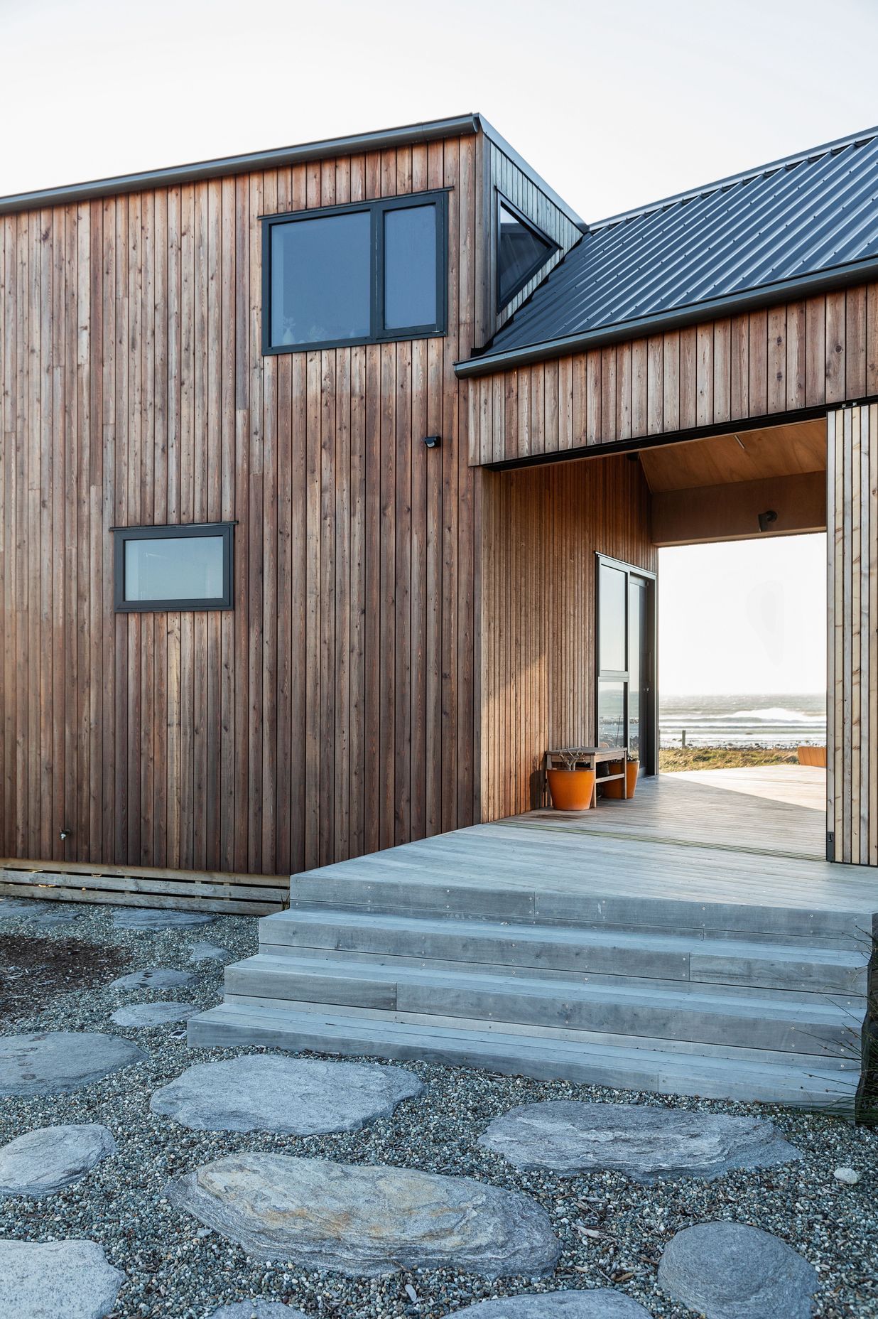 The breezeway connects the two dwellings while capturing the surrounding views. | Photographer: Sandra Henderson