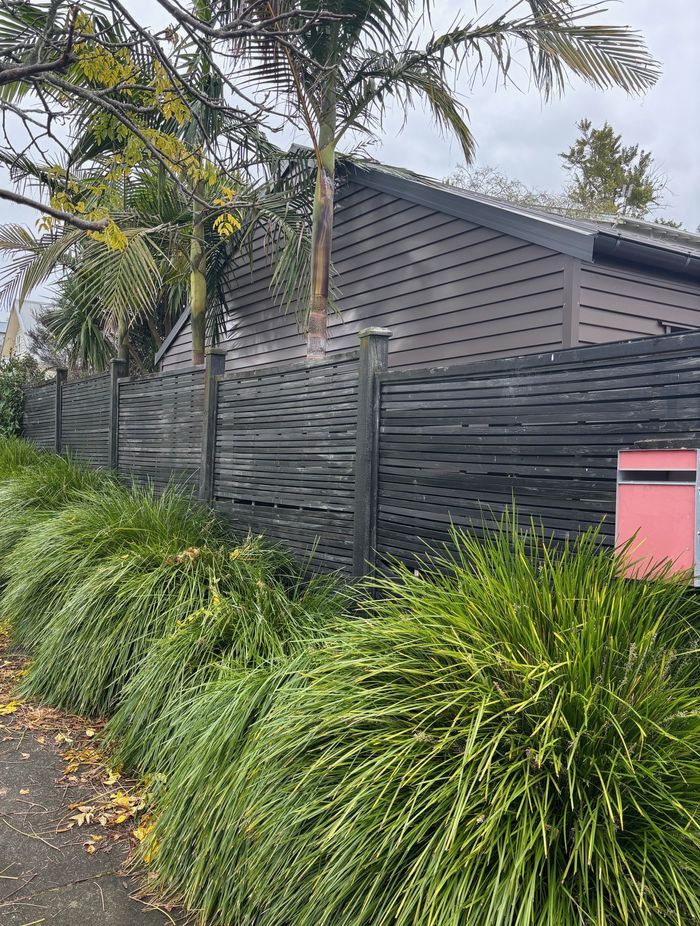 Old horizontal slat timber fence