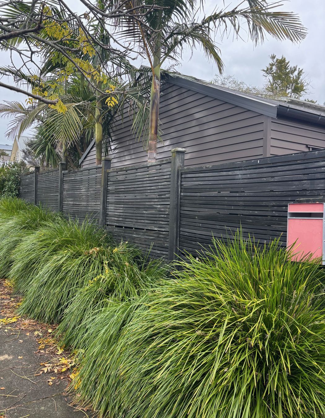Old horizontal slat timber fence