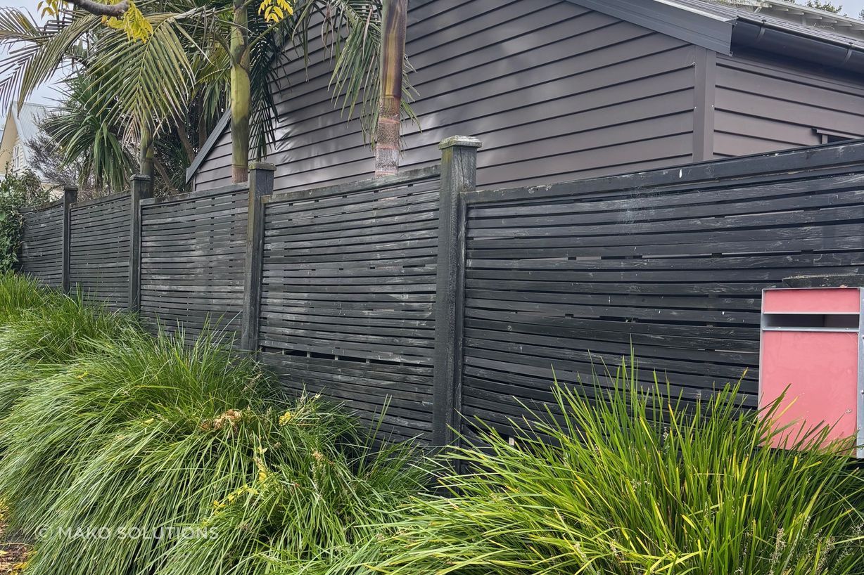 Old horizontal slat timber fence