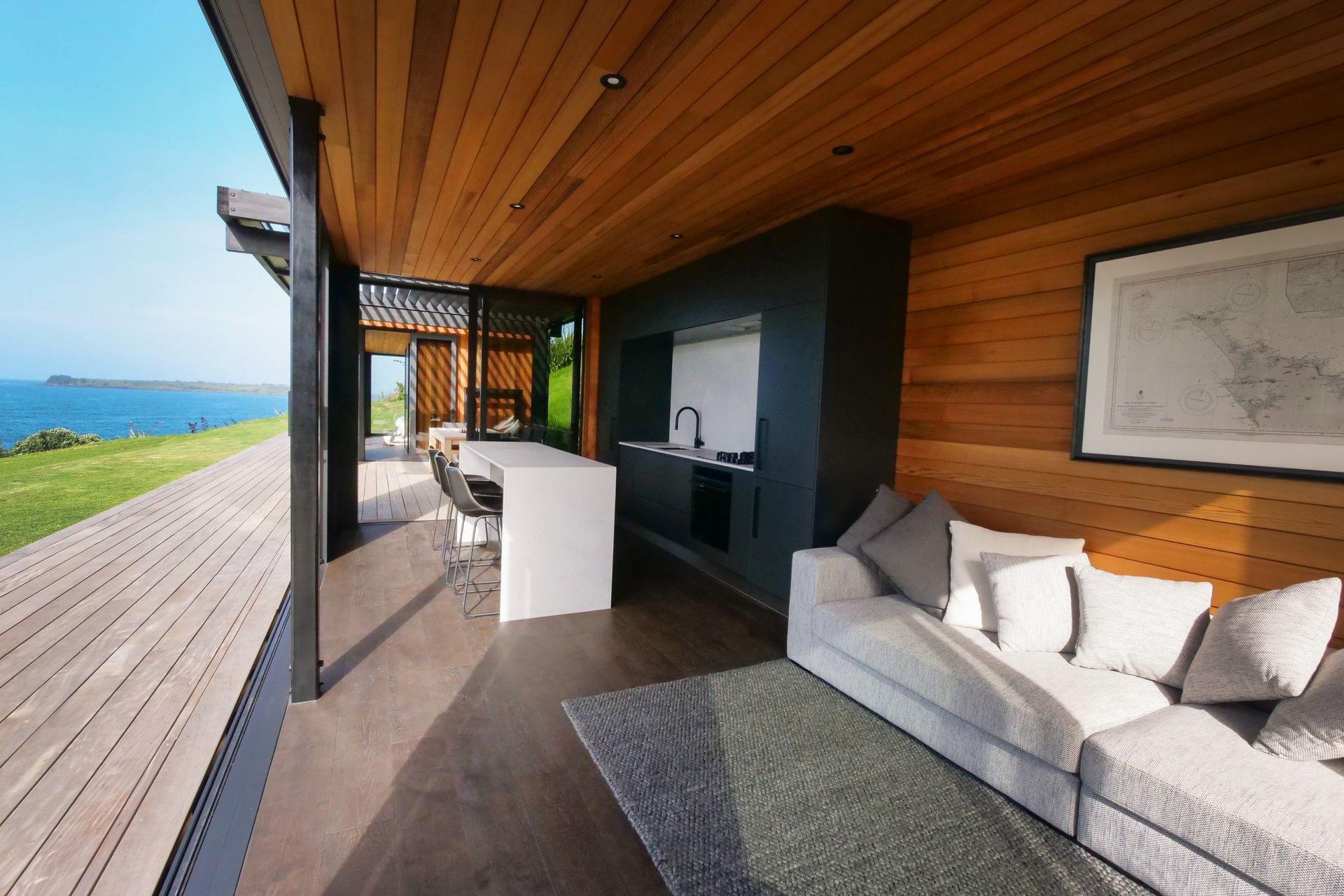 The living space is located in one pod, and the bedroom and bathroom in the other.