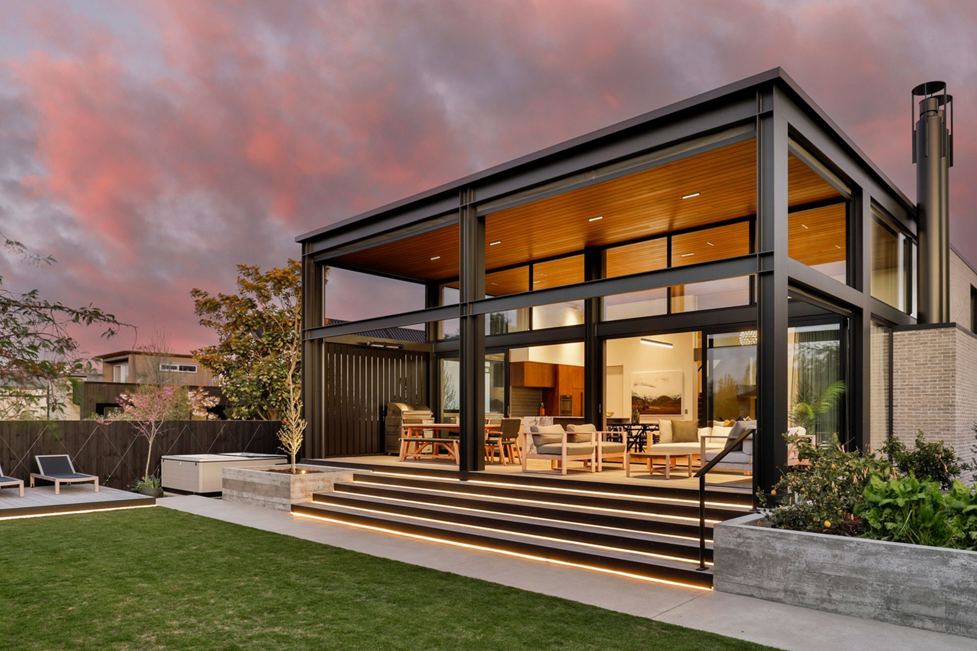 The minimalist backyard, seamlessly interlaced with the verandah. | Photographer: Jamie Cobel