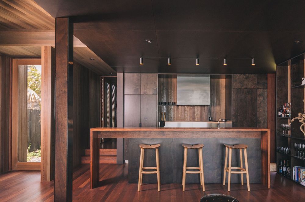 The kitchen is characterisied by deep, rich tones and a wealth of texture in the timbers.