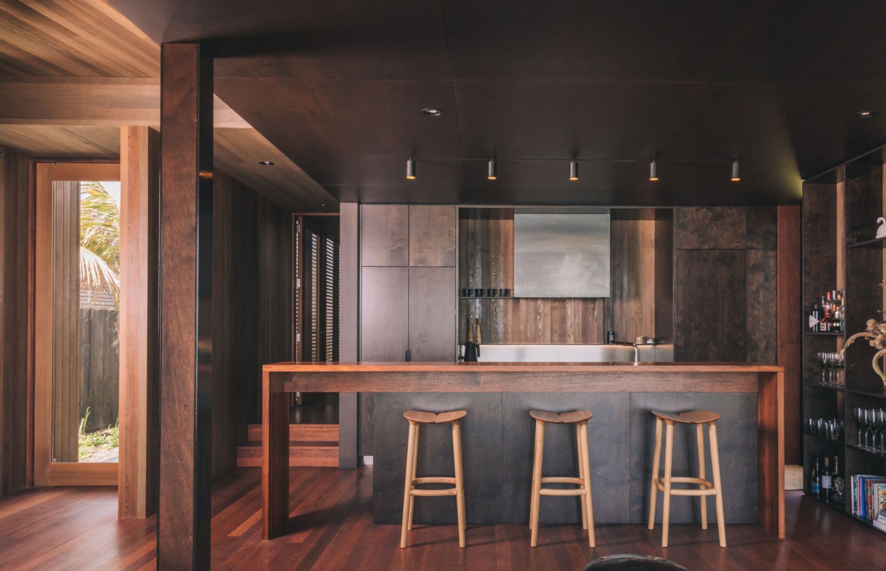The kitchen is characterisied by deep, rich tones and a wealth of texture in the timbers.