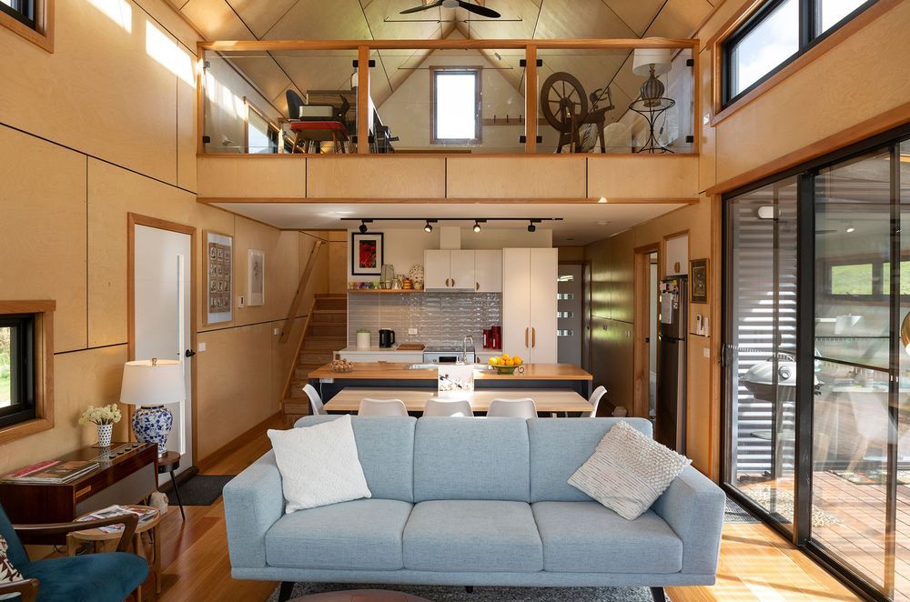 The living area skilfully optimises space. Photographer: Charlie Brown.