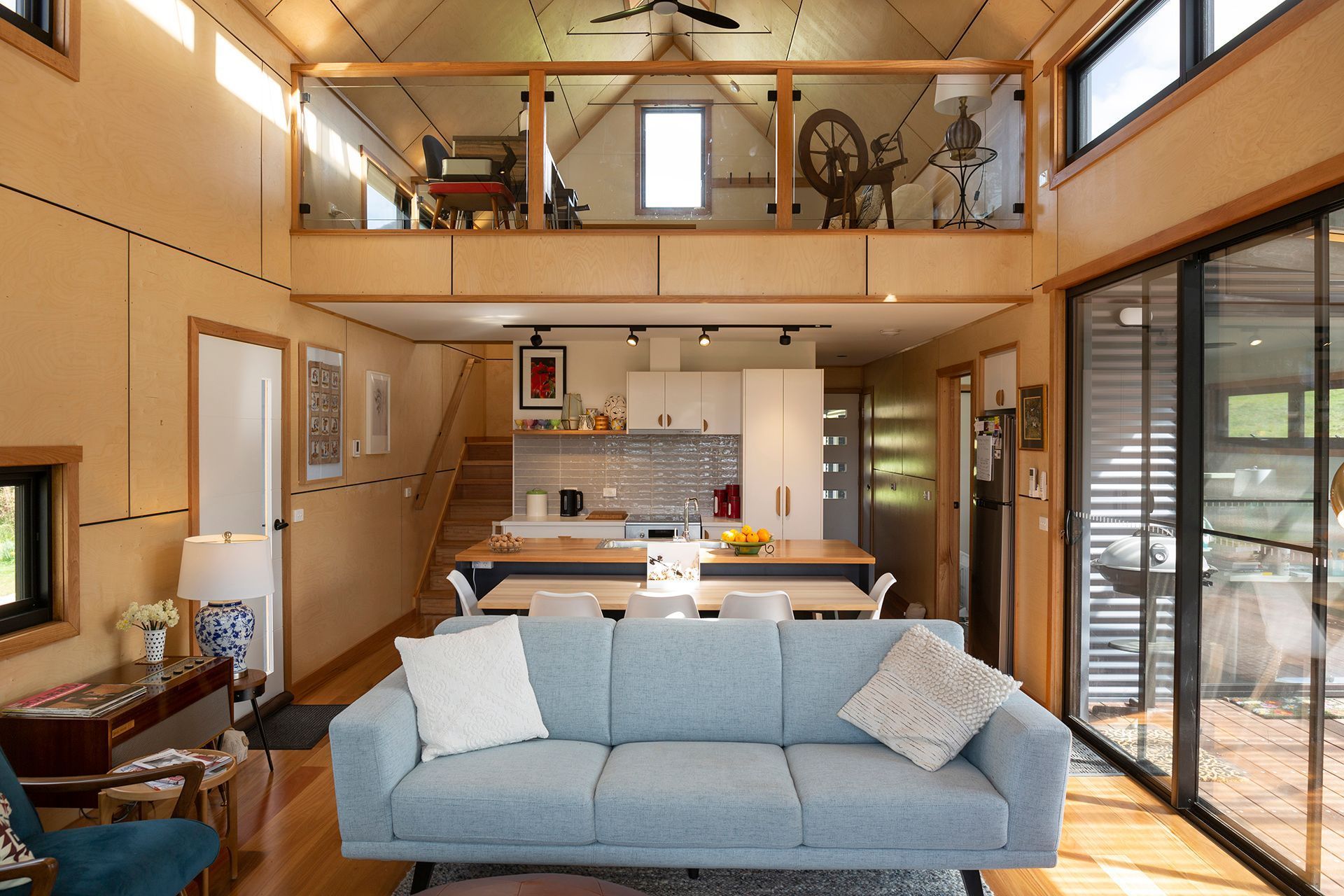 The living area skilfully optimises space. Photographer: Charlie Brown.
