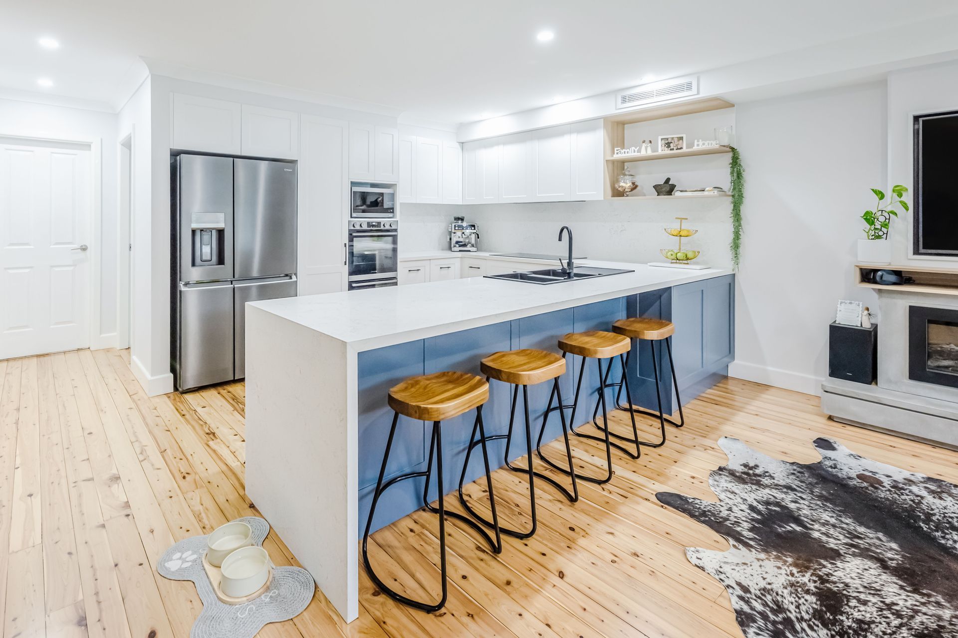A bright and airy kitchen where the kitchen bench effectively utilises space.
