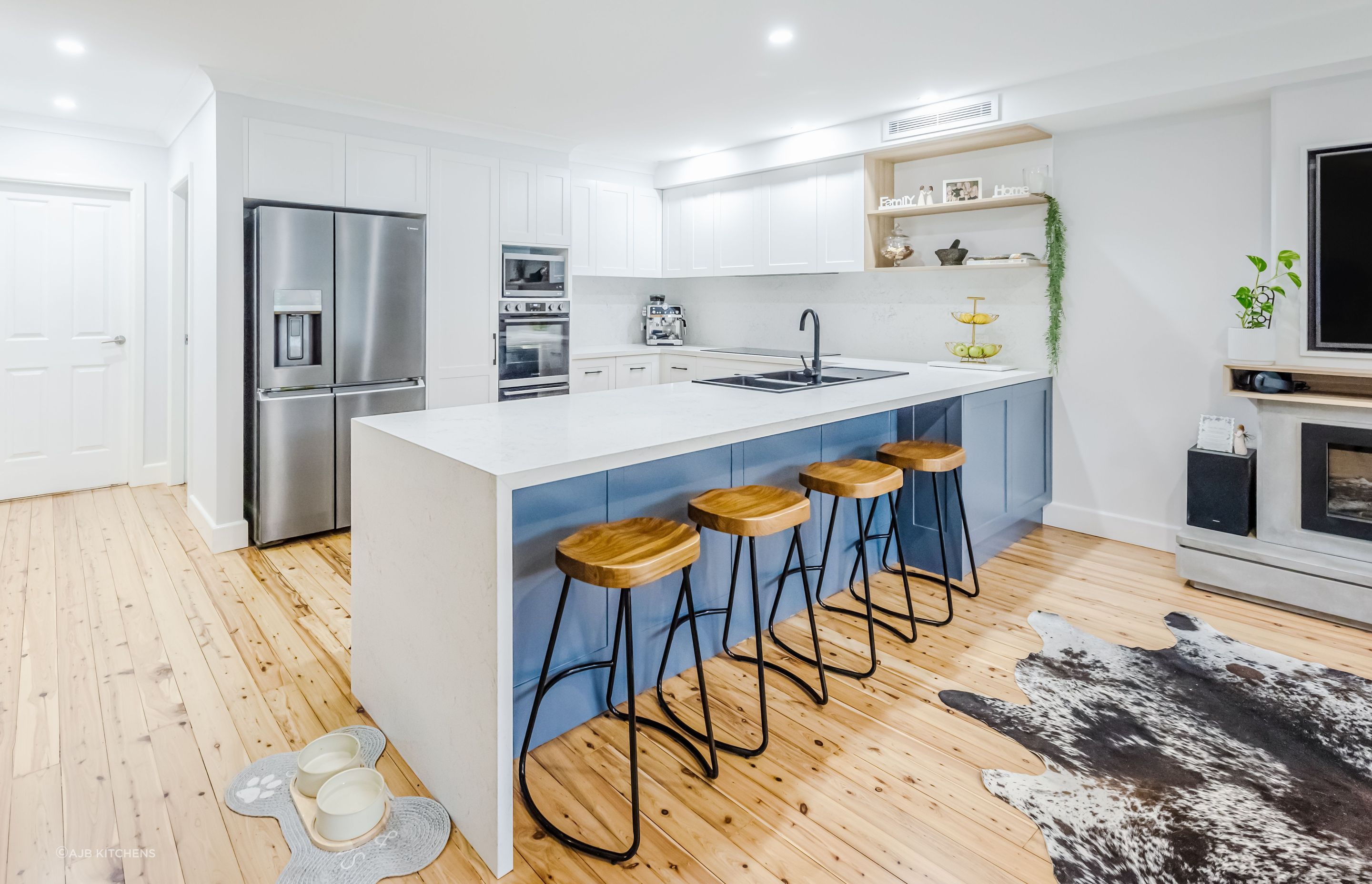 A bright and airy kitchen where the kitchen bench effectively utilises space.