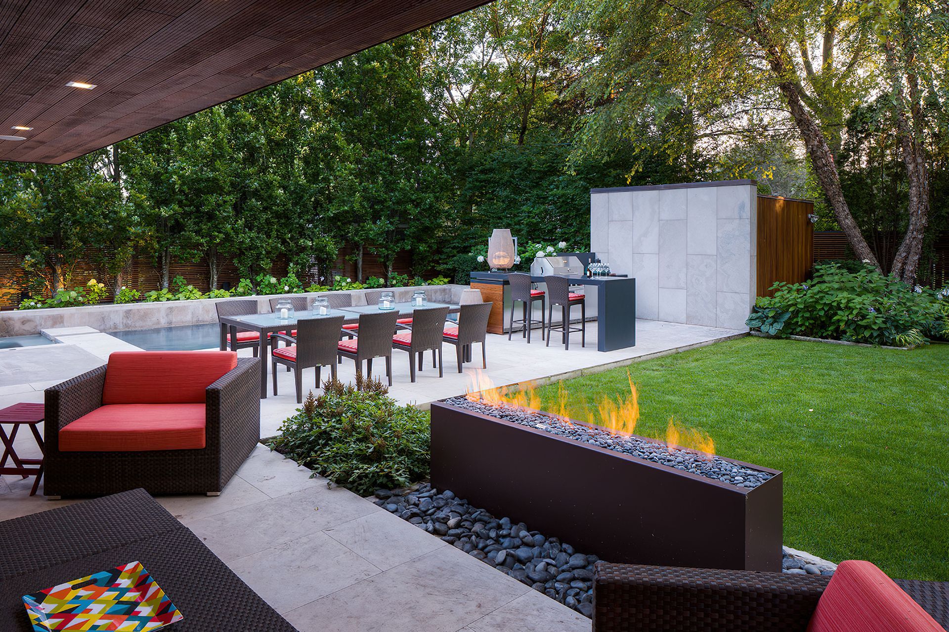 Organic materials like concrete, cedar and large-format stone tiles adorn this immaculate outdoor kitchen