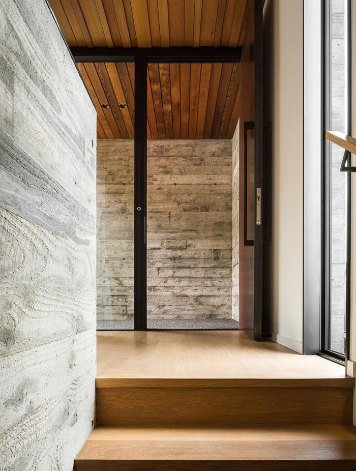 The entryway opens directly to the stair, providing a logical pathway down to the living space below.