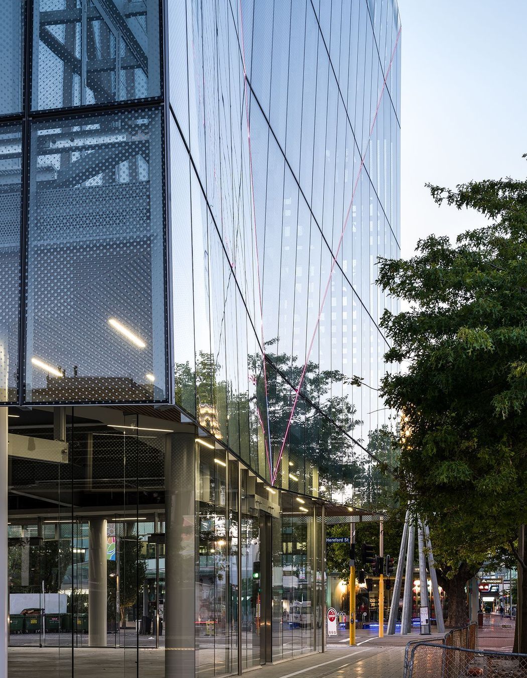  A close-up view shows the twin-skinned facade hanging like a curtain over the walkway and the fritting on the glass panels. Photograph: Dennis Radermacher/Lightforge.