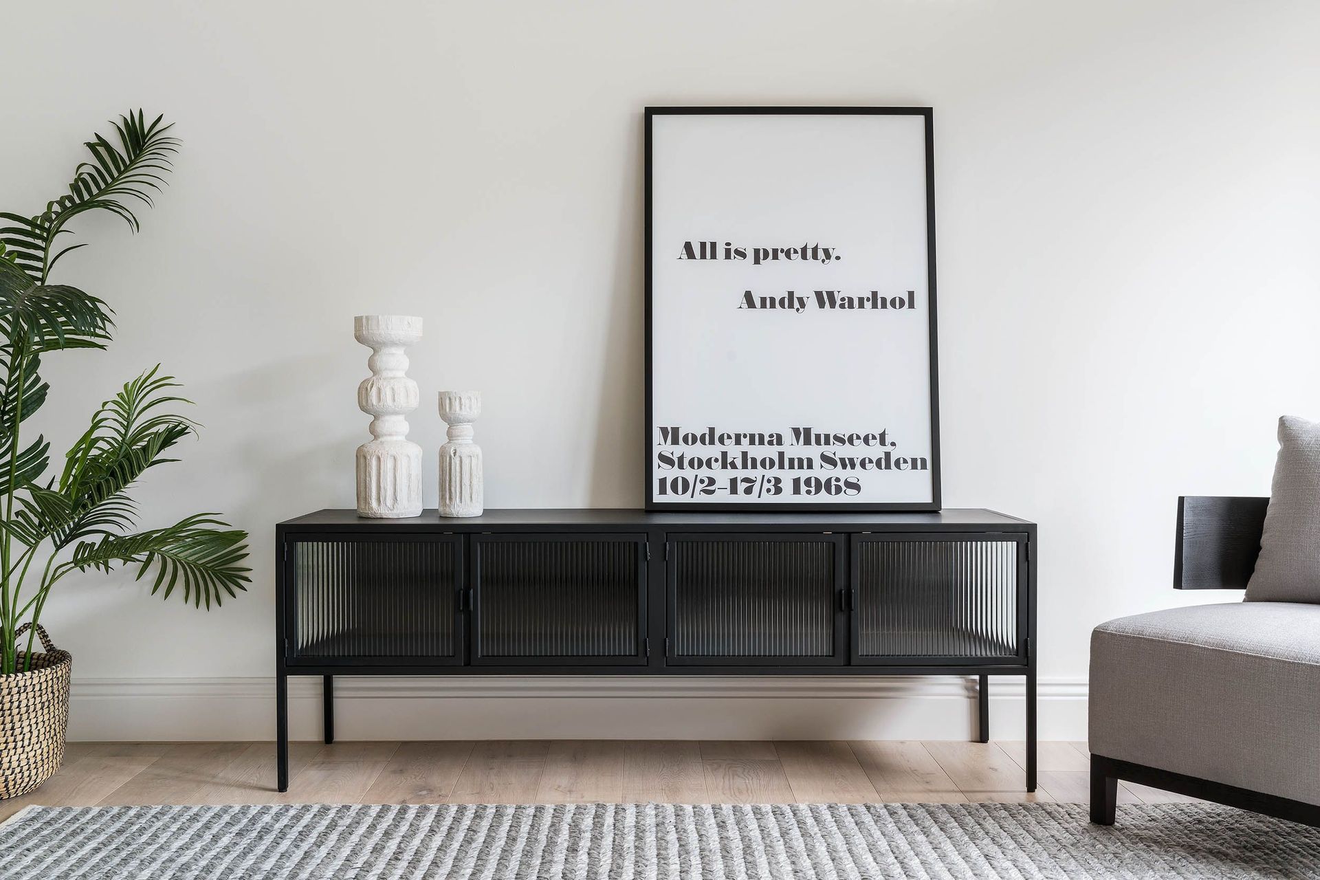 Industrial with a twist of Art Deco - the powder coated metal and glass Ambrose Entertainment Unit