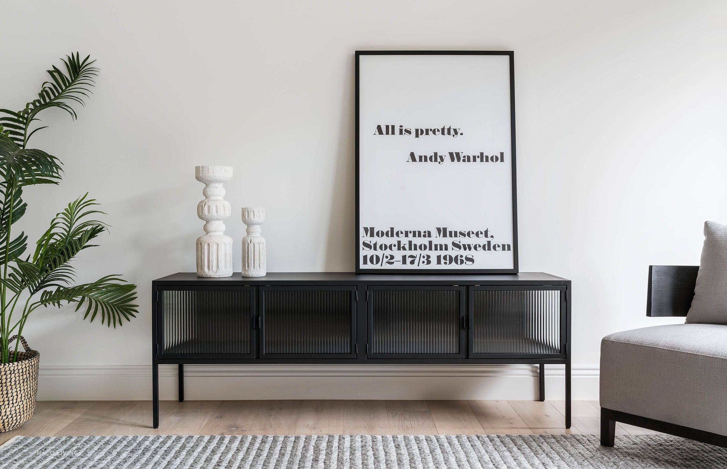 Industrial with a twist of Art Deco - the powder coated metal and glass Ambrose Entertainment Unit