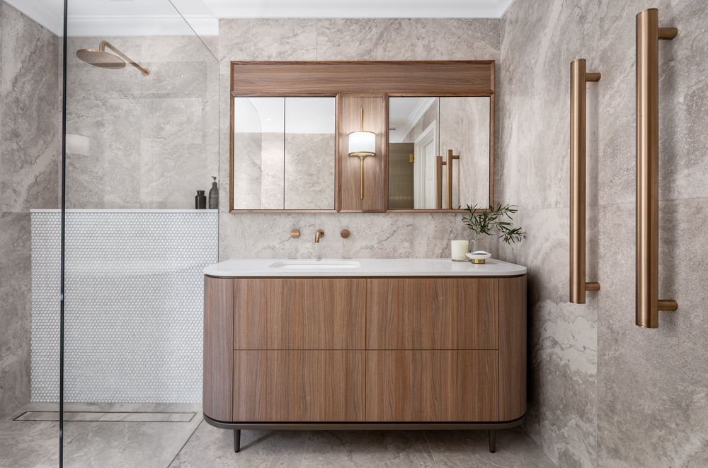 Mirrored cabinets offer functional storage space. Featured project: Lovegrove Project