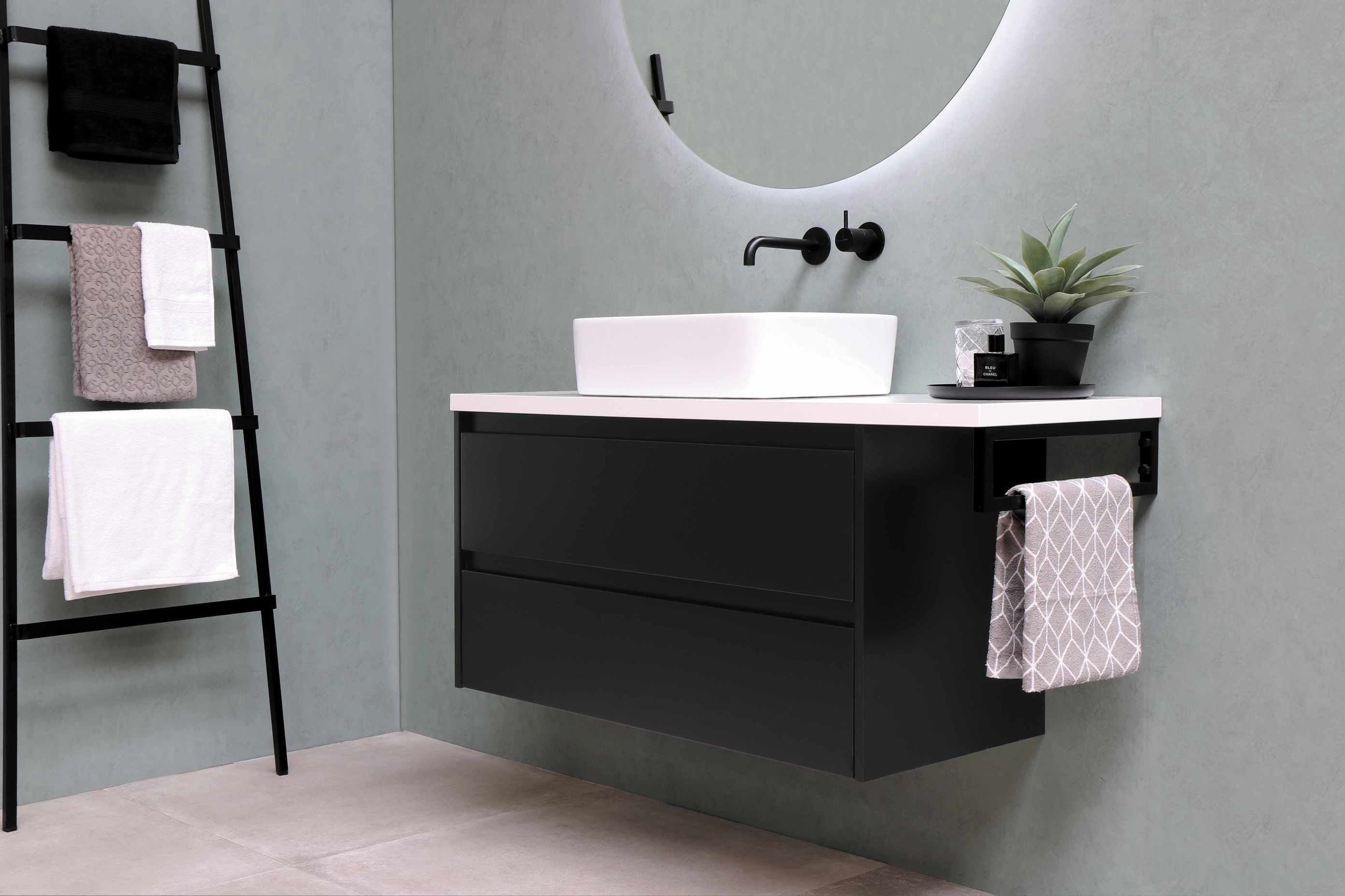 This ladder propped against the wall is a great place to hang your towels and it also makes for a great design element.