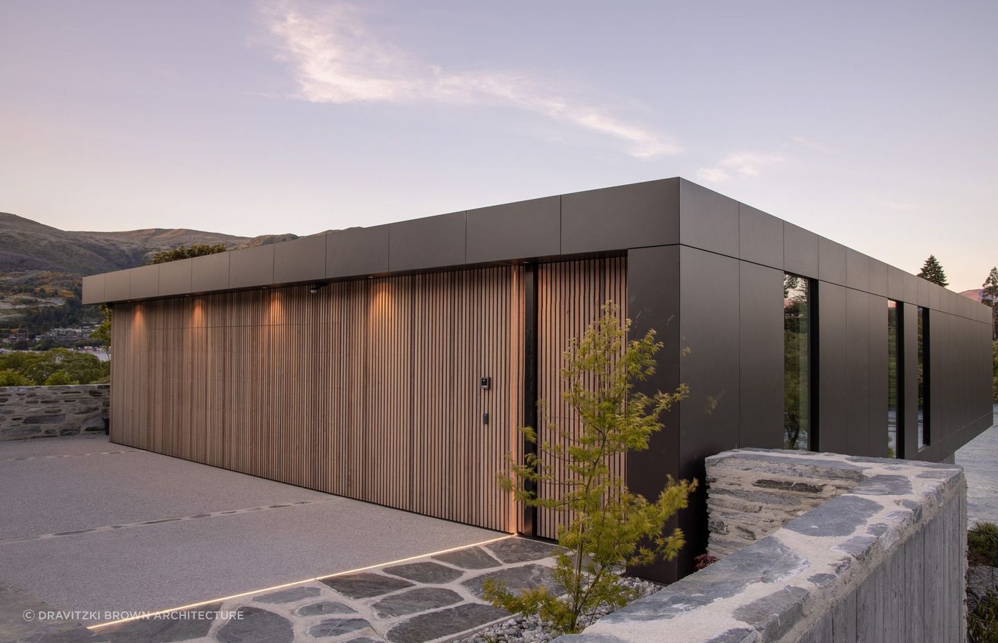 A stylish example of a concealed door in cedar in this exquisite lakeside property in Queenstown - Photography: Alister Brown