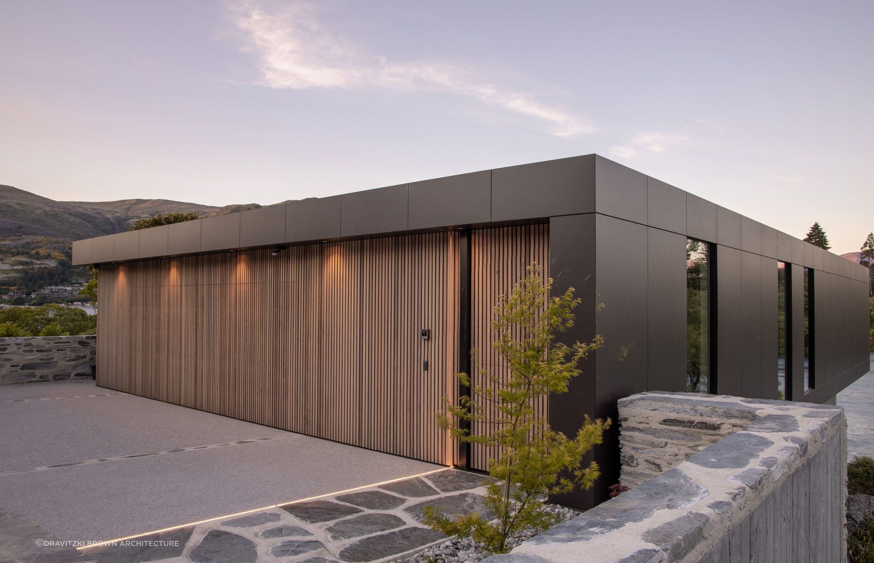A stylish example of a concealed door in cedar in this exquisite lakeside property in Queenstown - Photography: Alister Brown