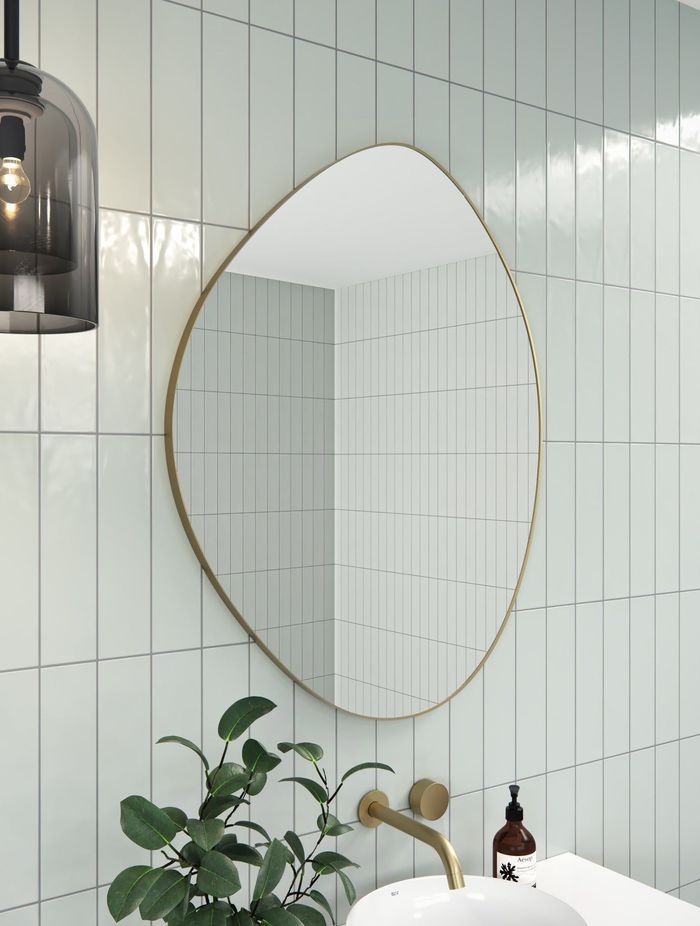 A pebble-shaped bathroom mirror offers a refreshing twist on traditional bathroom mirror shapes. Featured product: Pebble Shape Mirror