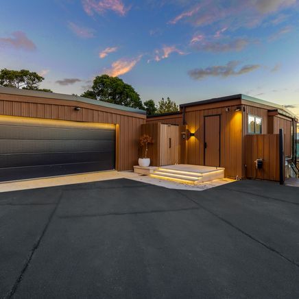 Meet the builders behind this cedar-clad home on the shores of Lake Pupuke