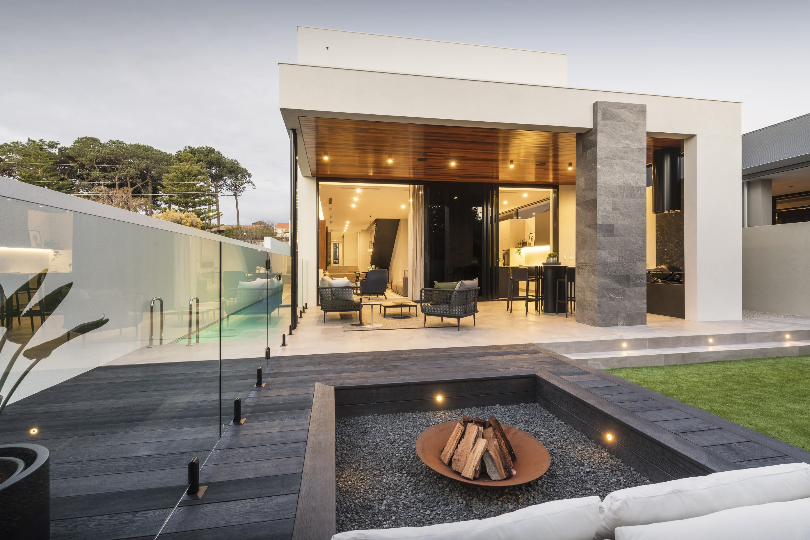 Backyard Fire pit featuring Burnt Cedar with lap pool