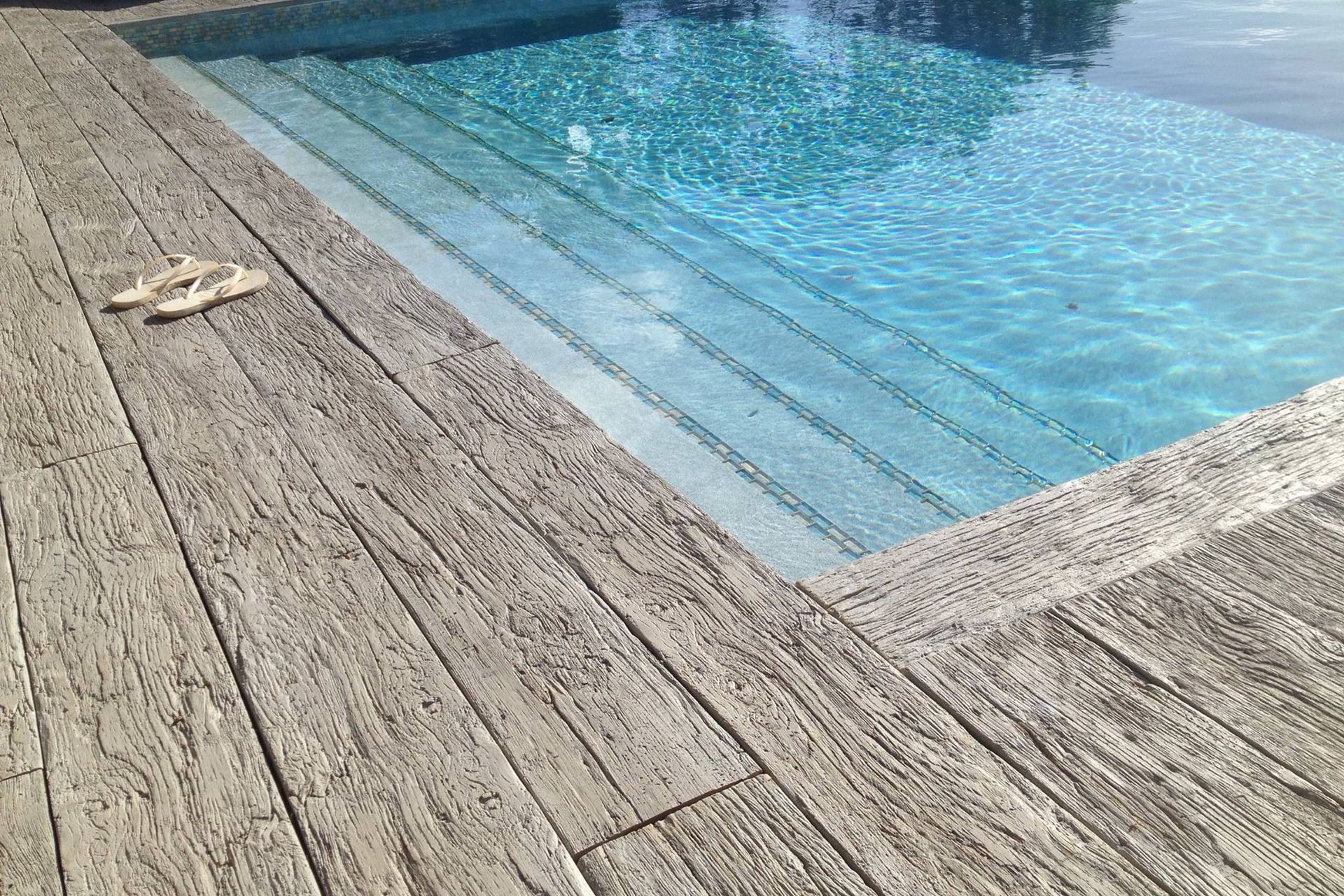 Weathered Oak Driftwood infinity edge pool Caribbean Islands