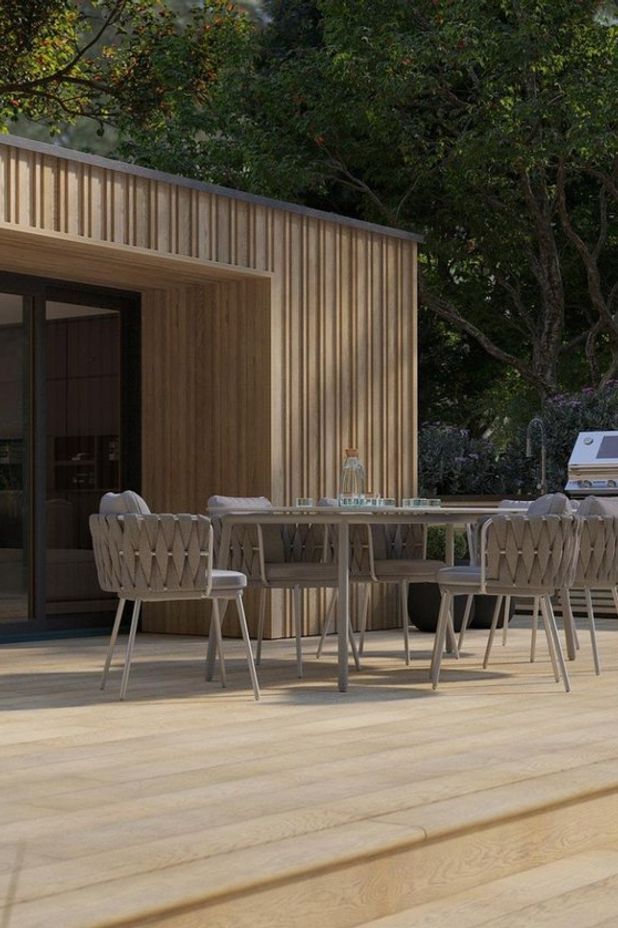 Envello board & batten cladding in golden oak by Millboard Decking