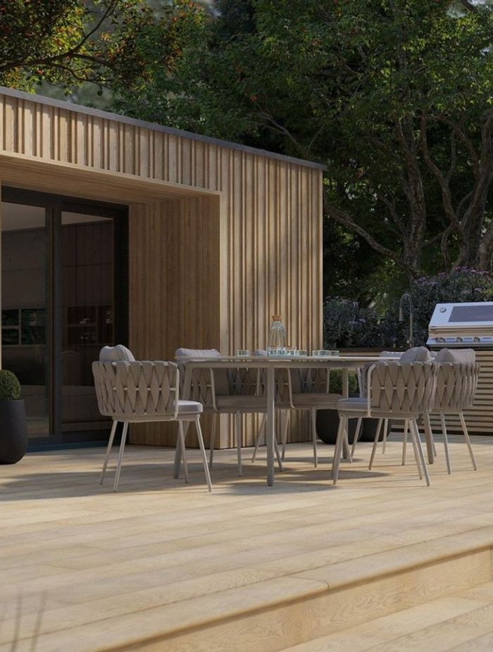 Envello board & batten cladding in golden oak by Millboard Decking
