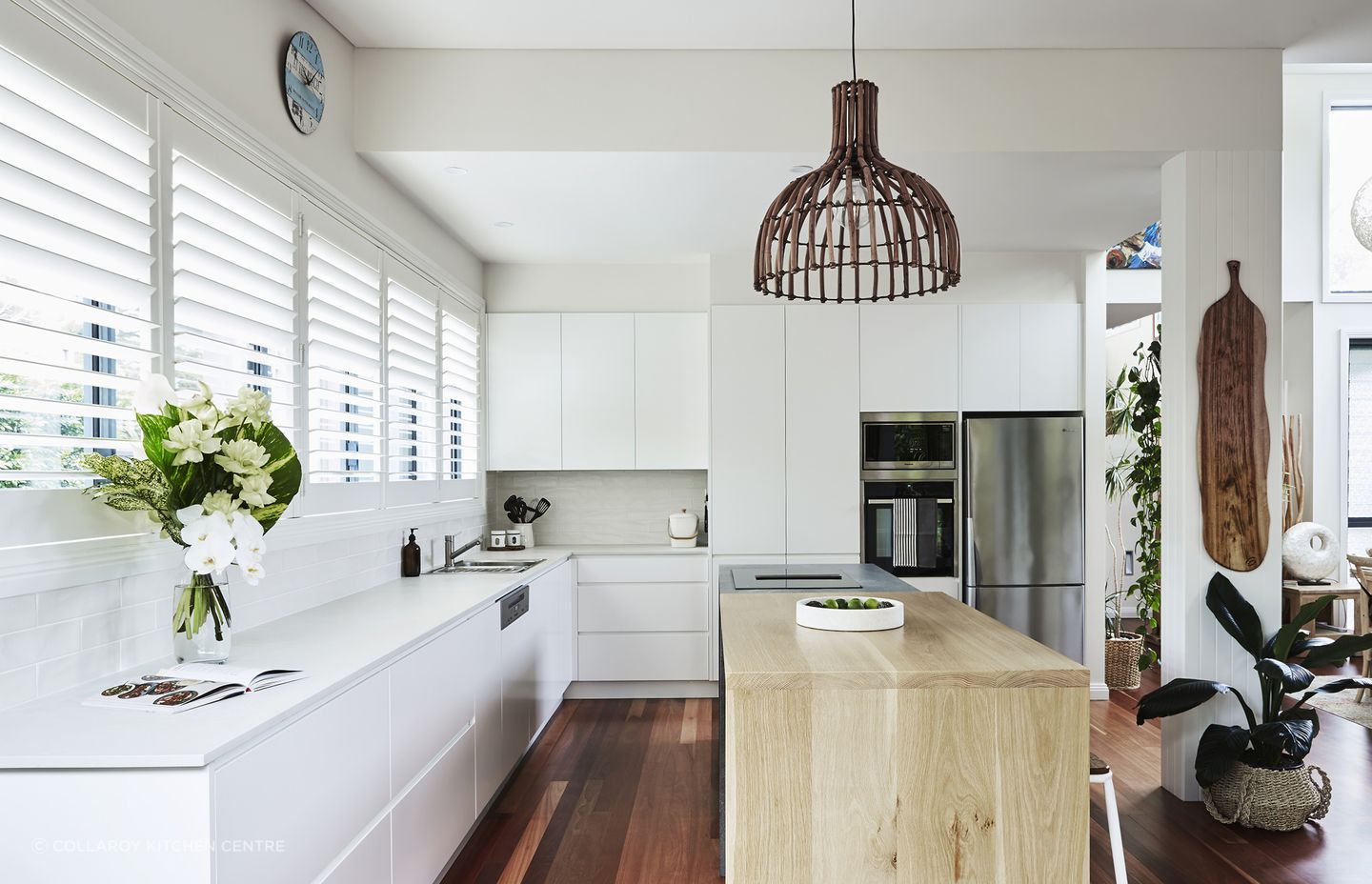 This timber kitchen bench works as a practical centrepiece in this kitchen.