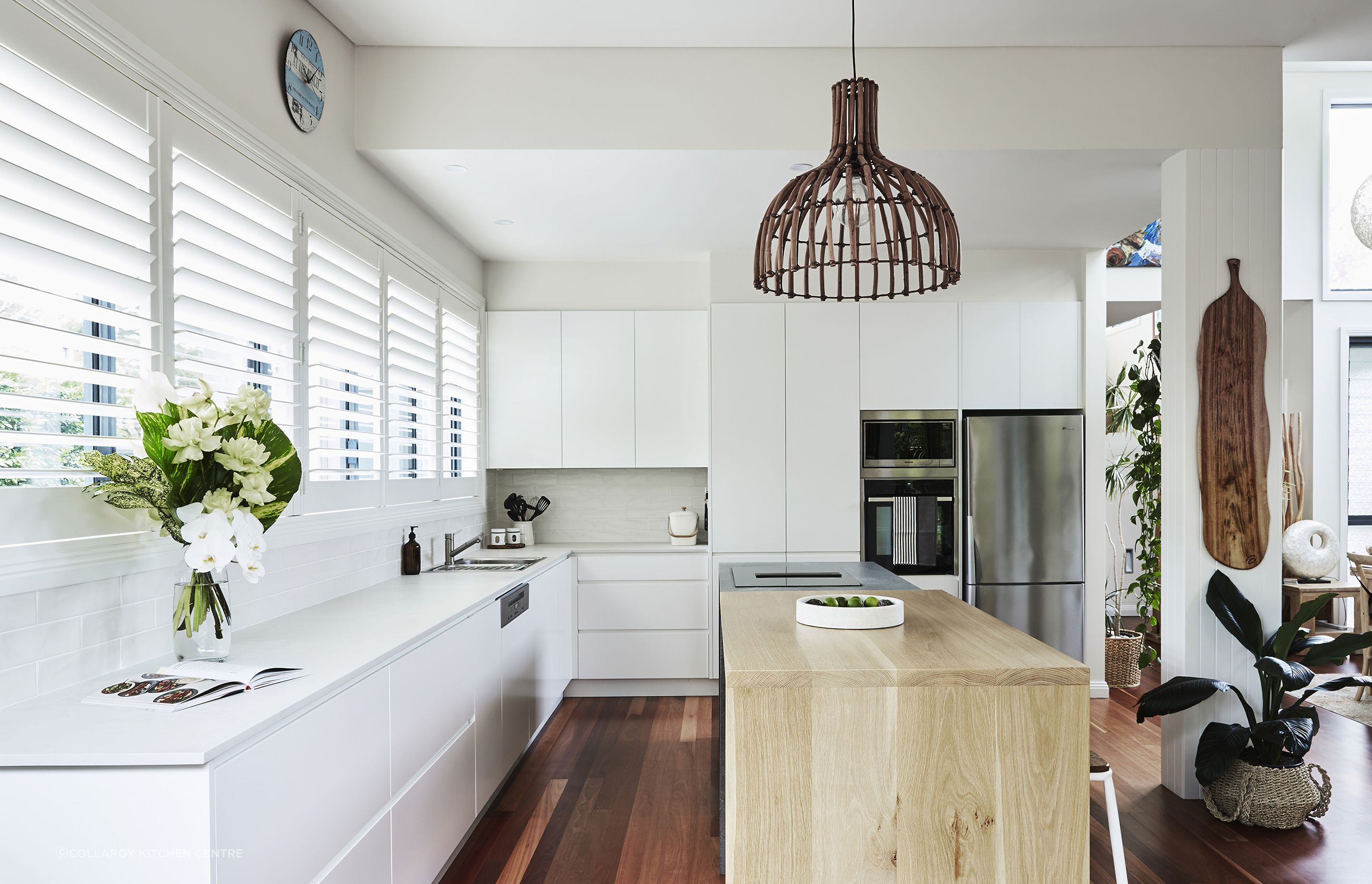 This timber kitchen bench works as a practical centrepiece in this kitchen.