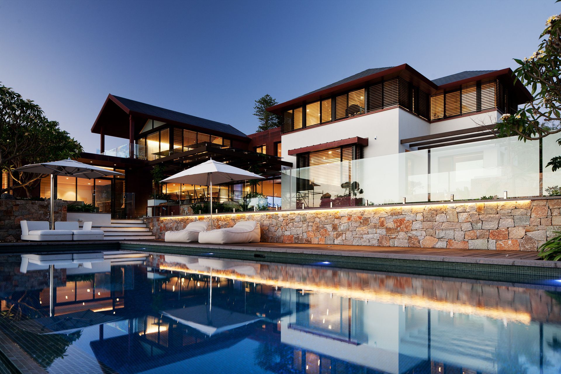 This expansive multigenerational home comprises two adjacent residences with a large shared outdoor area | River House by Neil Cownie Architect | Photography by Robert Frith