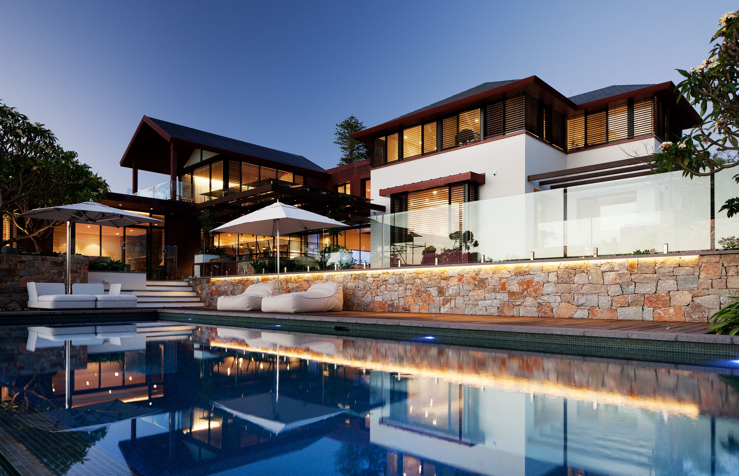 This expansive multigenerational home comprises two adjacent residences with a large shared outdoor area | River House by Neil Cownie Architect | Photography by Robert Frith