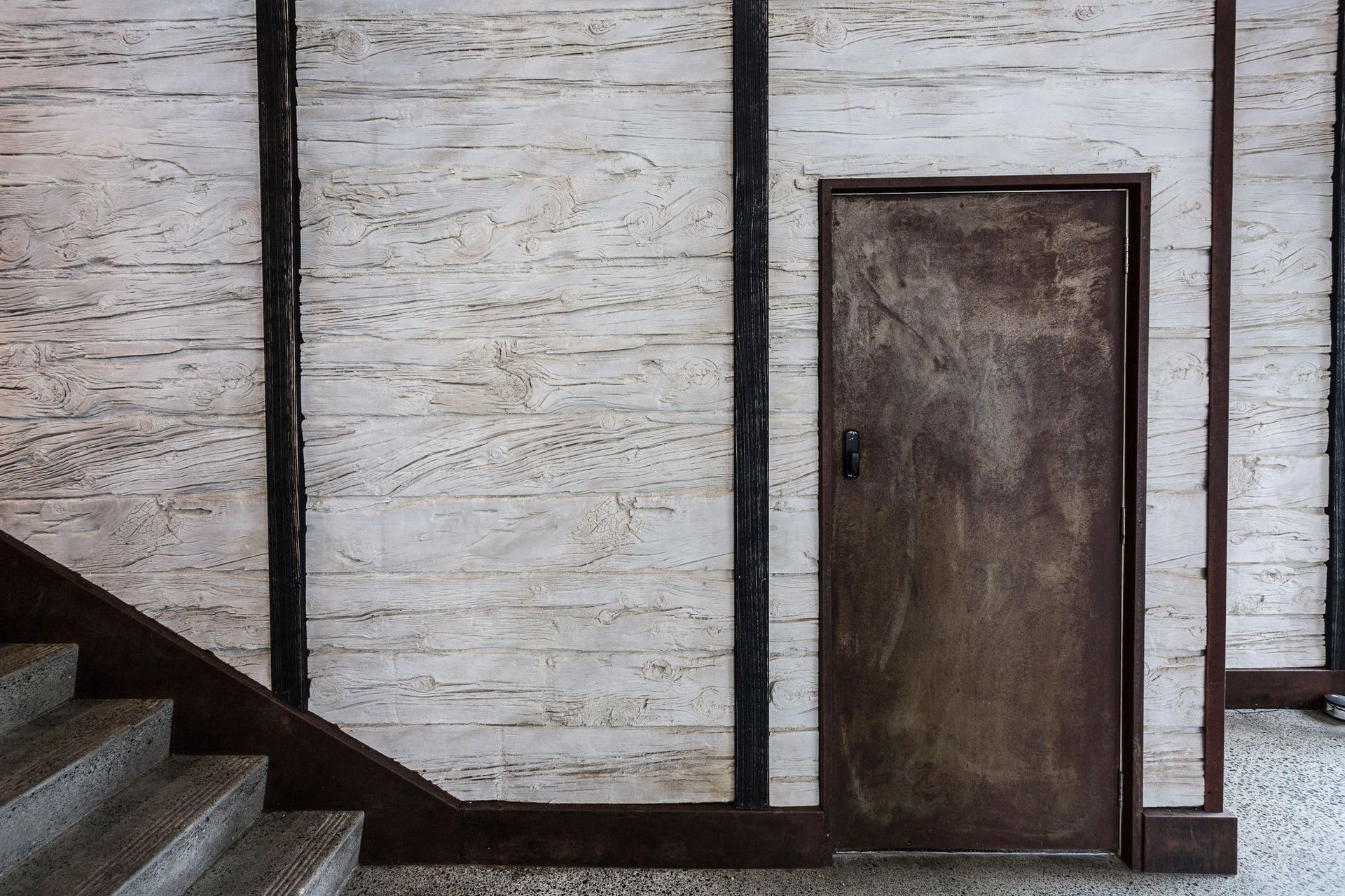 Wooden sleeper wall panels offer a rustic look.