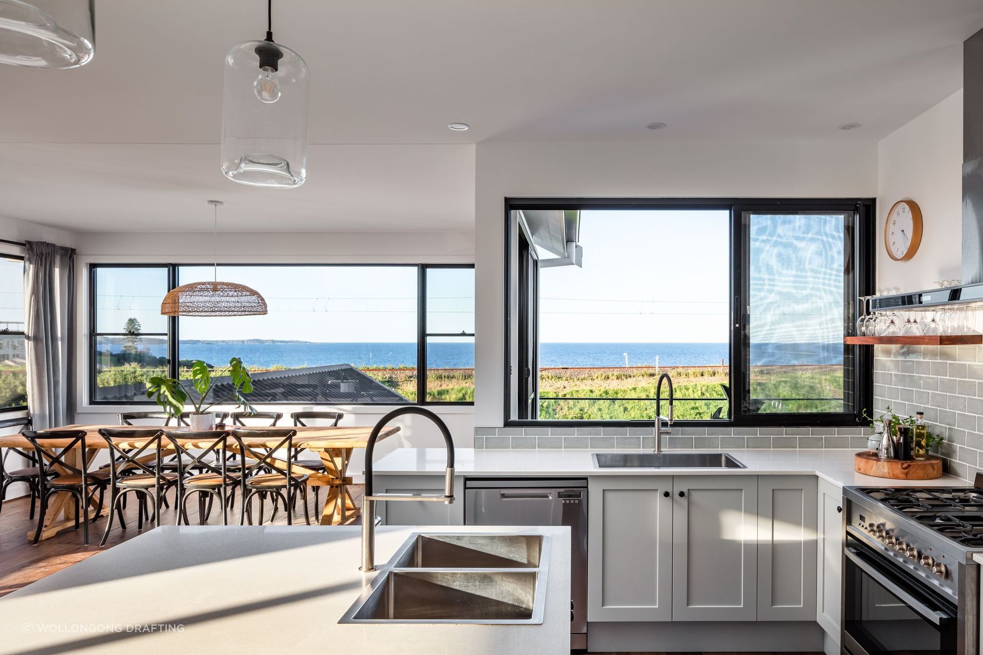 The kitchen and dining area intertwine nicely. Photographer: Shaw Photography.