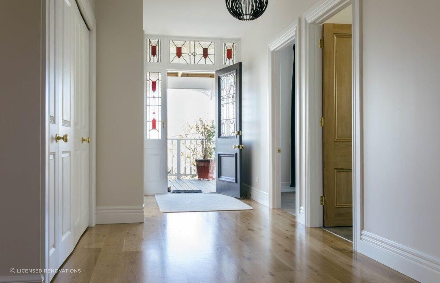 From inside out or outside in, stained glass in and around a front door looks great, seen here in this Northcote Villa Restoration - Photography: Nathan Clark