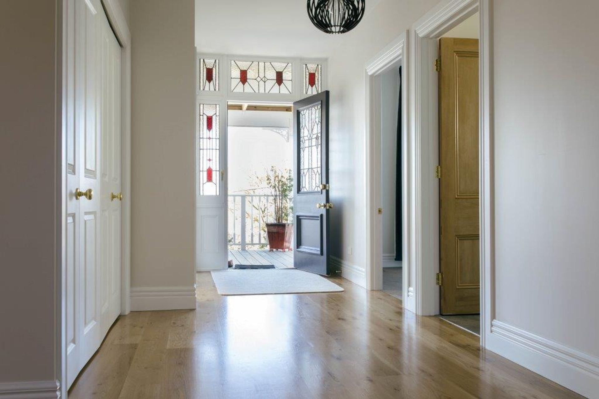 From inside out or outside in, stained glass in and around a front door looks great, seen here in this Northcote Villa Restoration - Photography: Nathan Clark