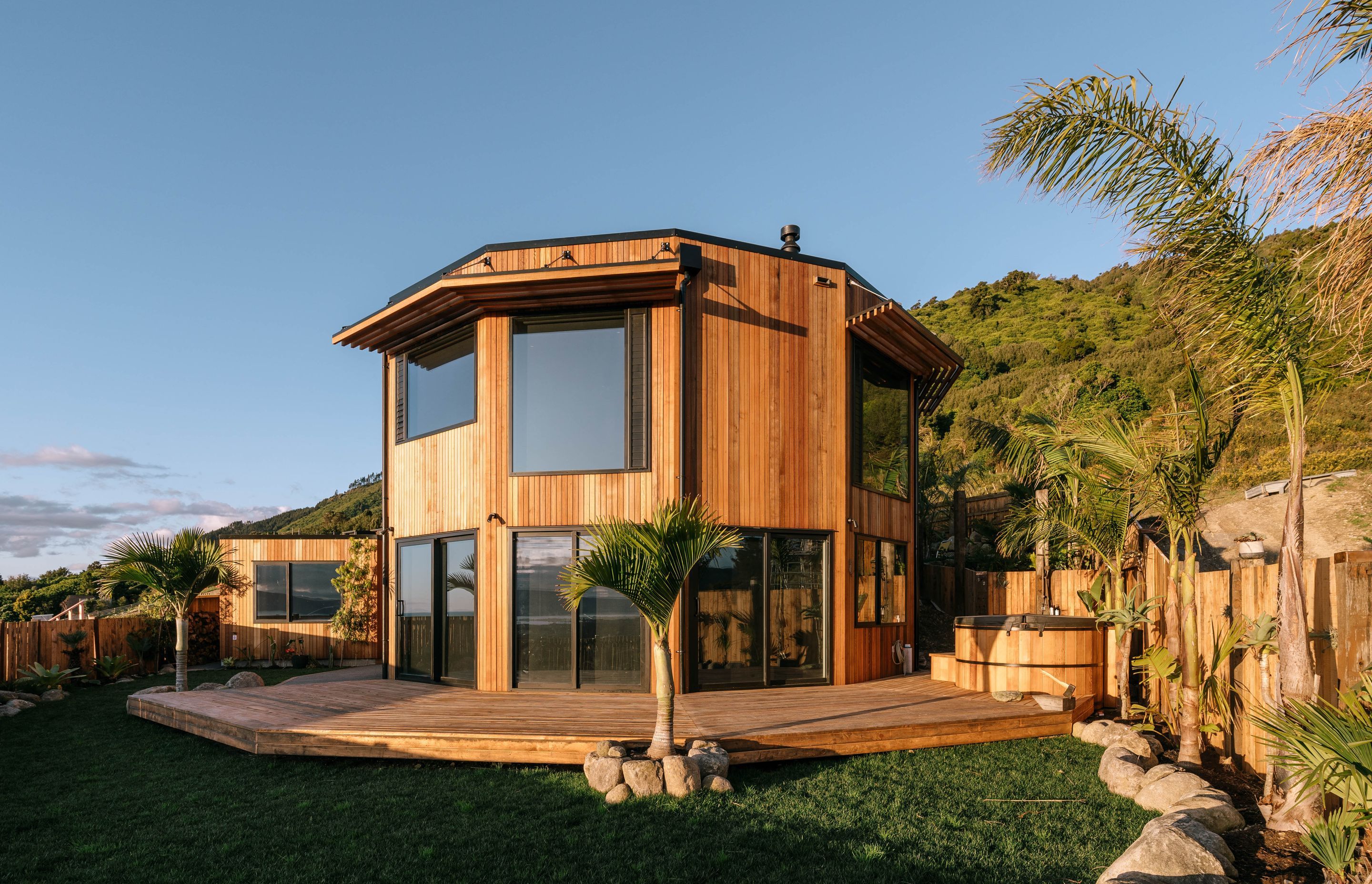 The spacious outdoor living area, complete with an outdoor shower and hot tub.