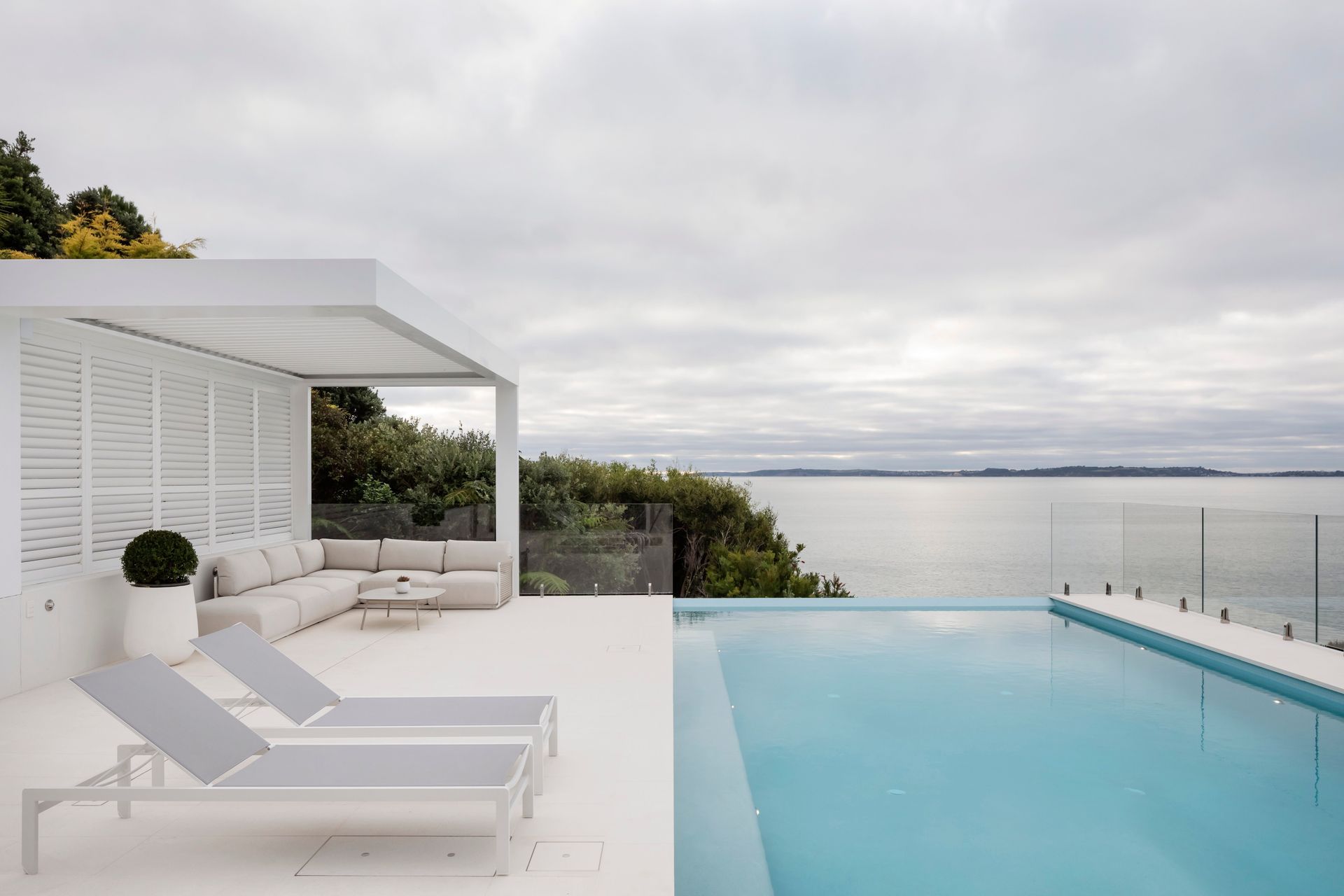 The pool for this high end Orewa project sits on highly engineered piles drilled deep into the cliff overlooking the bay.