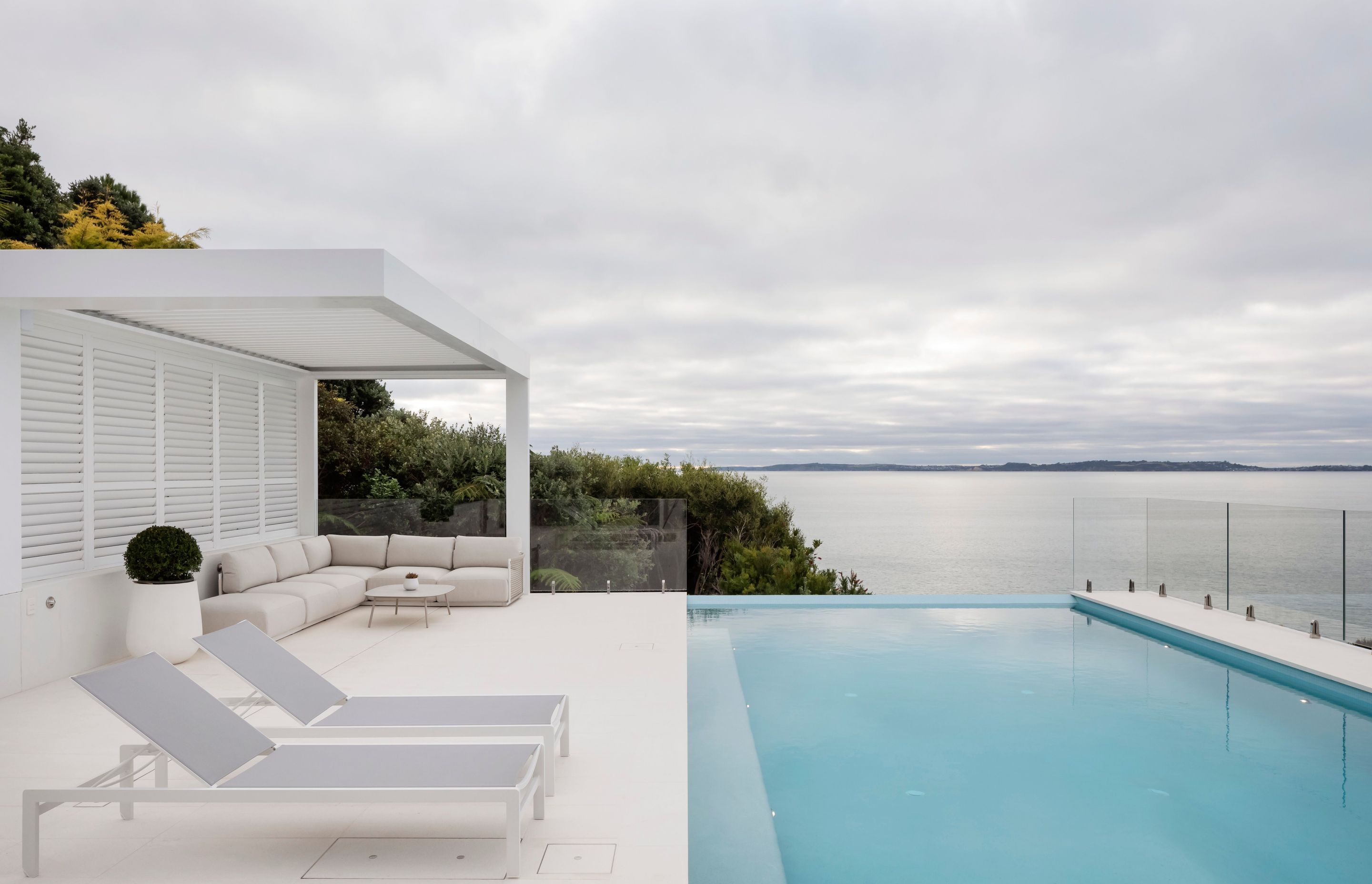 The pool for this high end Orewa project sits on highly engineered piles drilled deep into the cliff overlooking the bay.