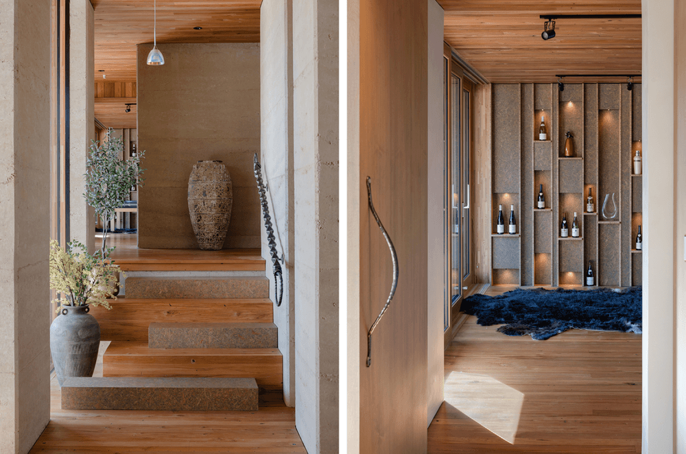 Strand board elements can be found throughout the home, in this instance as every second stair and also on the custom feature wall in the second lounge, which displays some of the owner's—a wine maker—collection of wines.