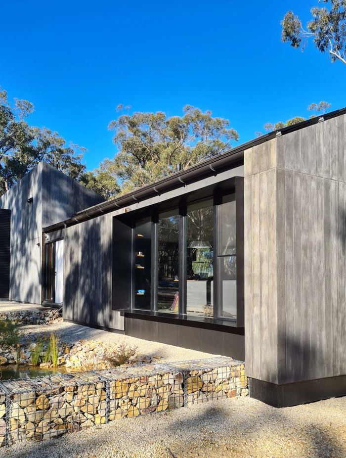 The two forms of the house slope in opposing directions – one side best utilises the sun for the solar panels whilst the other allows solar penetration into the house.