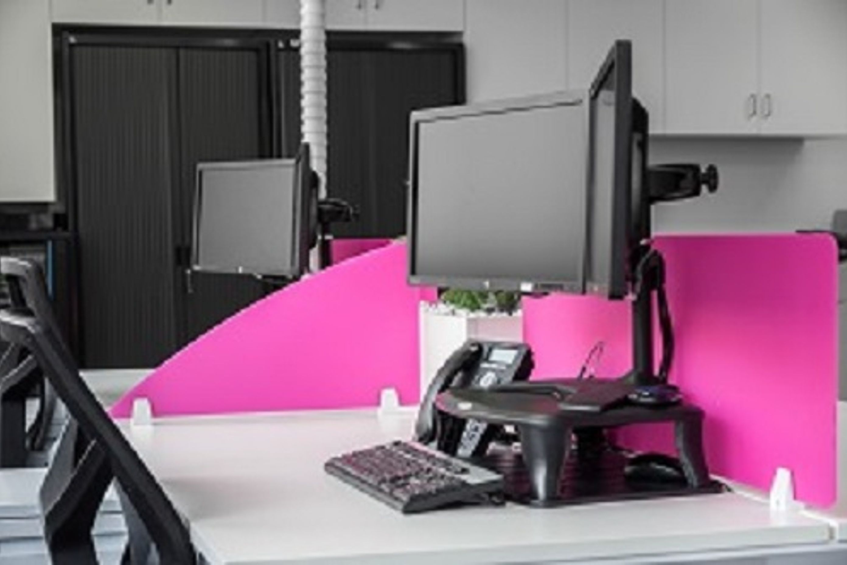 Double monitors at the Premium Strata office that has been designed by Inspired Spaces