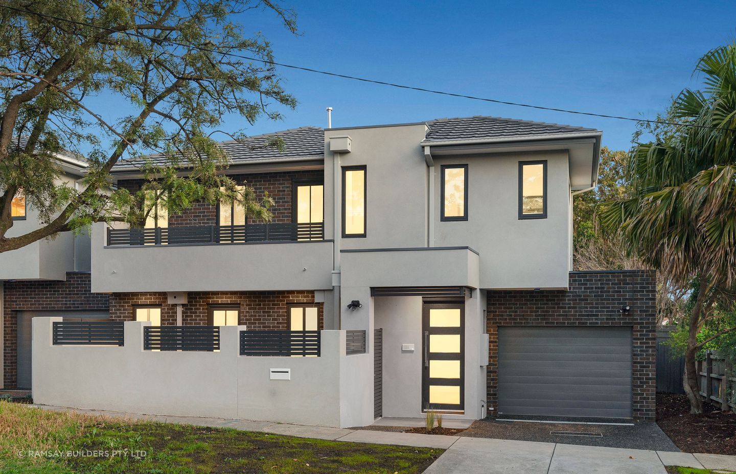 The dark brick exterior of this townhouse fits the suburban setting.