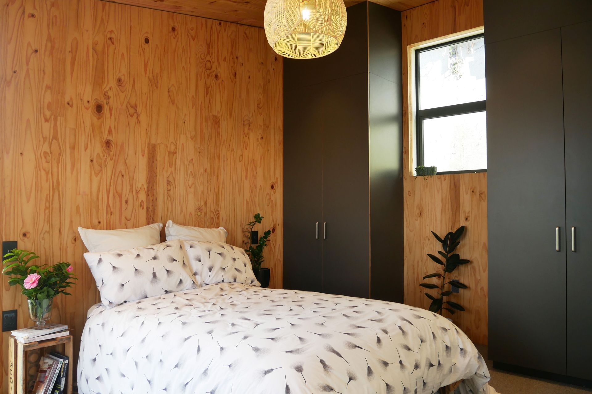 The warm, honey colour of the CLT panels creates an inviting palette in the bedroom module.