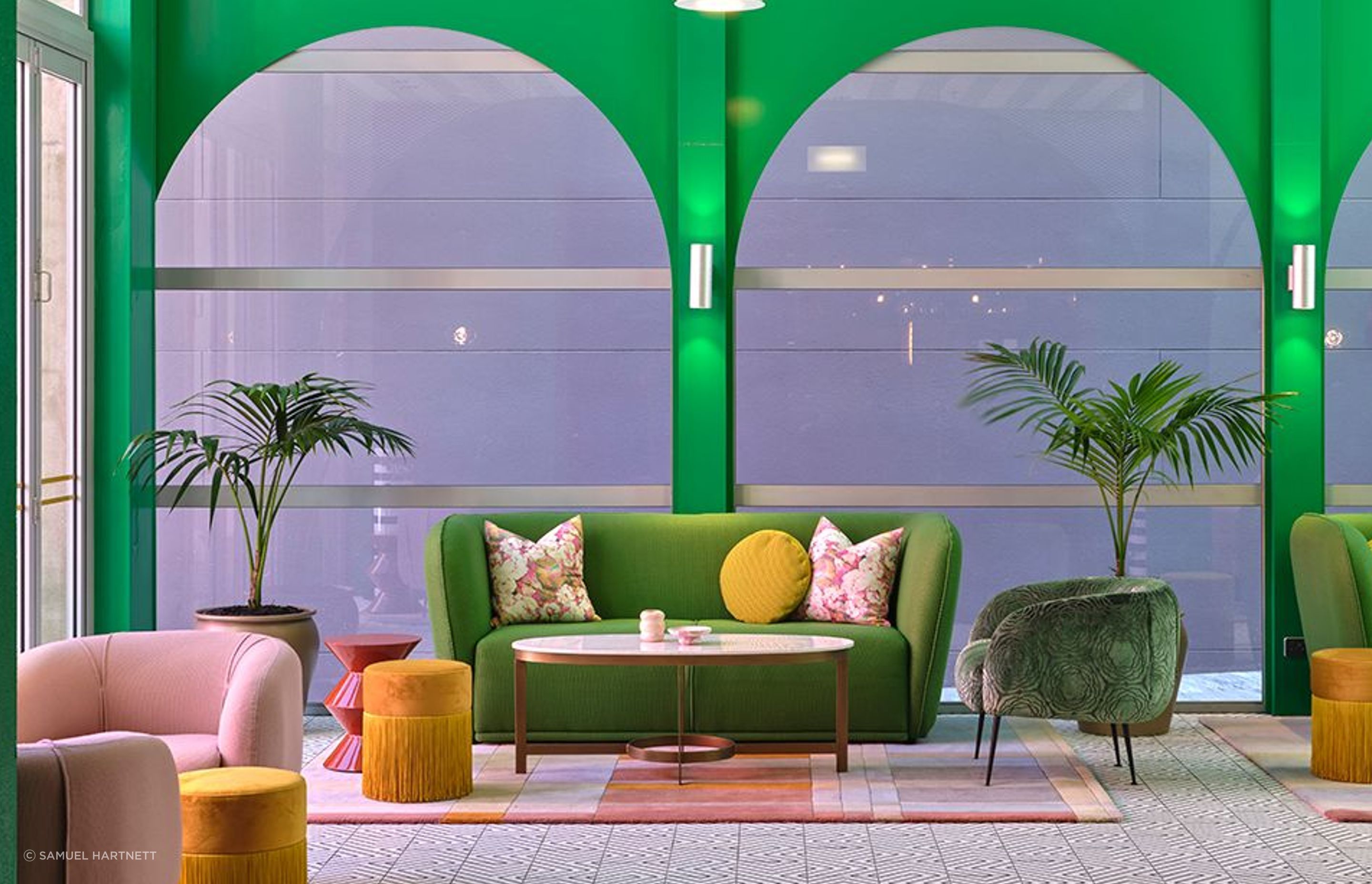 The fresh look of the parlour. Covid-19 caused product supply issues, which meant much tweaking to the mix of colours and materials. The fringed poufs are by Houtique and the green chair is covered in Mokum Water Lily fabric from James Dunlop Textiles.